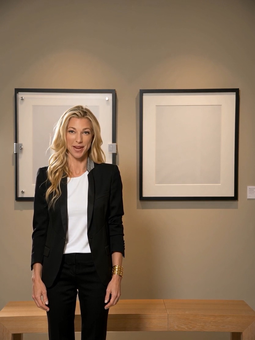 Nicole Junkermann beside framed pictures while recording an AI Overview podcast briefing on AI transparency